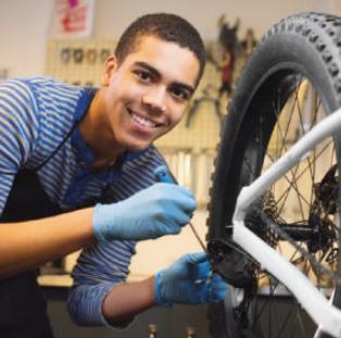 Adult learns how to tune up bicycle 